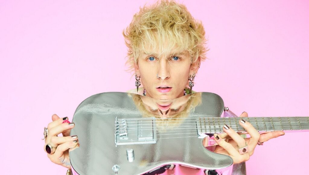 Machine Gun Kelly — Mainstream Sellout Machine Gun Kelly with a silver guitar. March 2022 album roundup.