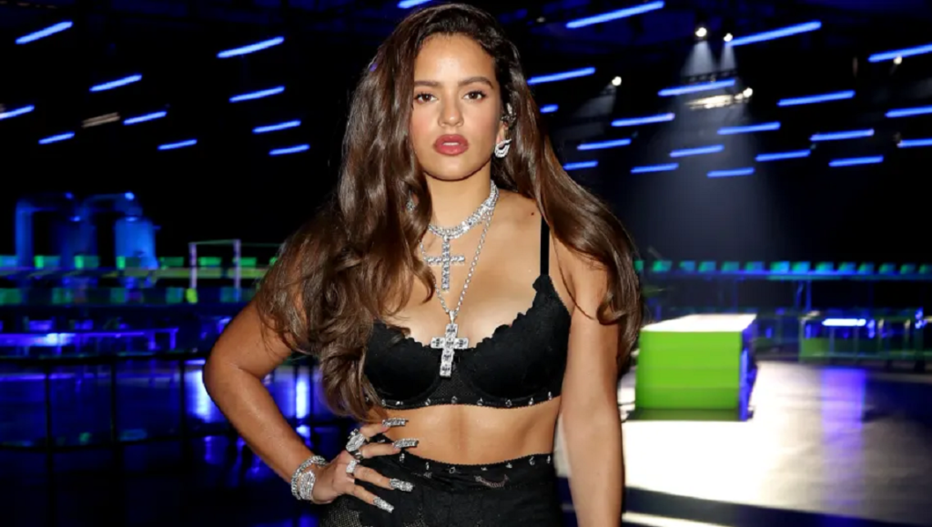 Rosalía — MOTOMAMI Rosalía, March 2022 album roundup. Singer with long brown hair and cross necklaces.