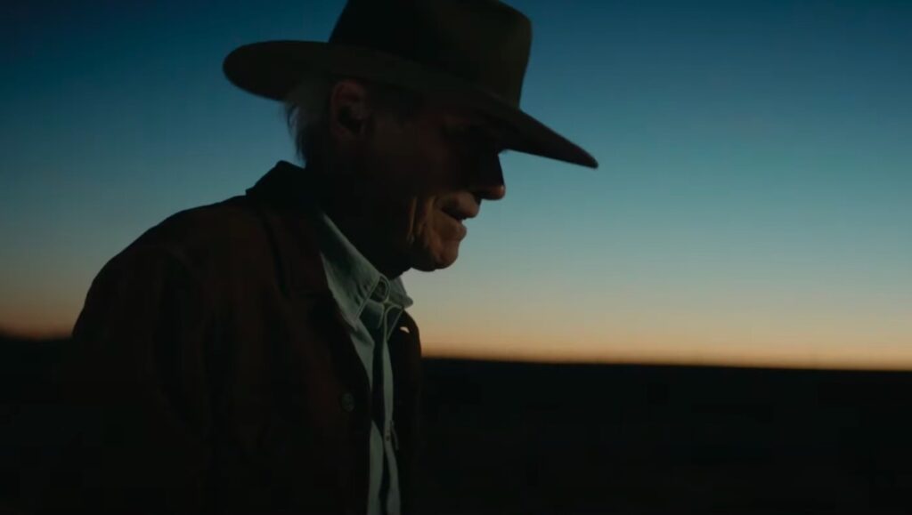 Clint Eastwood profile at sunset. Cowboy hat, western movie icon.