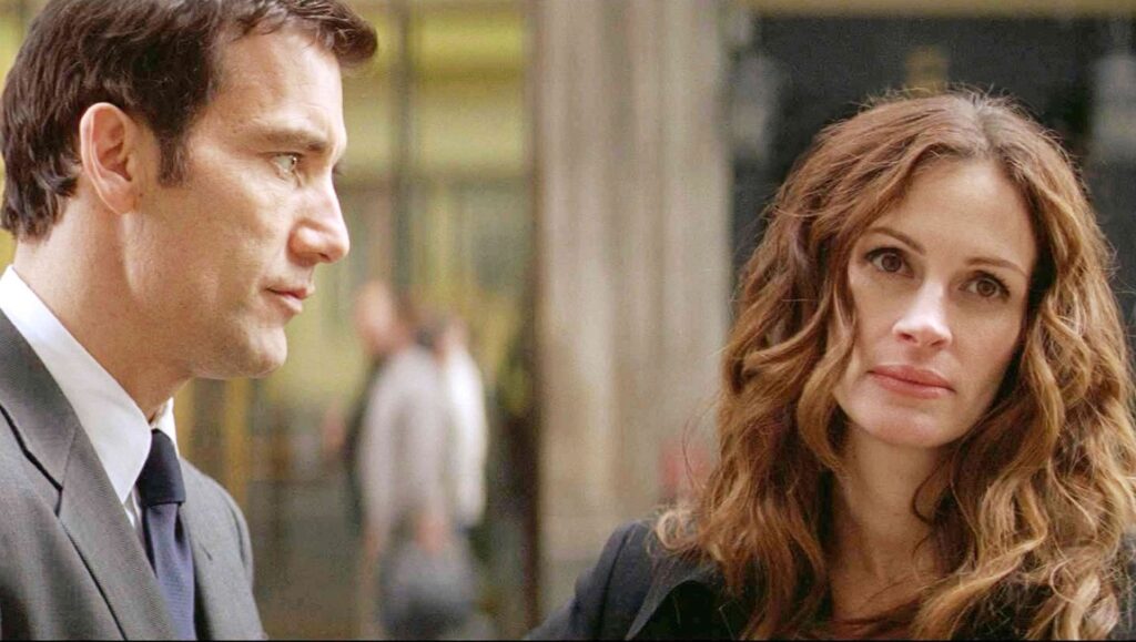 Duplicity movie scene featuring Clive Owen and Julia Roberts. Spy thriller film.