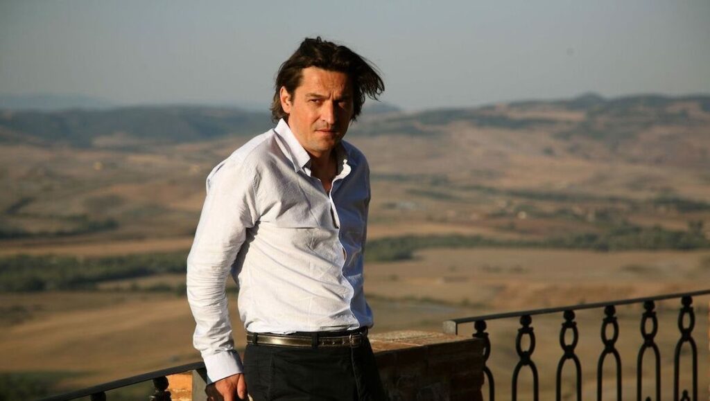 The Father of My Children — Mia Hansen-Løve Man in dress shirt with landscape view. Outdoor portrait of a handsome man. Style and fashion.