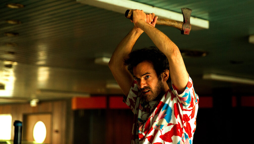 Final Cut at Cannes Film Festival: Man with axe. Horror film scene. Cannes 2022.