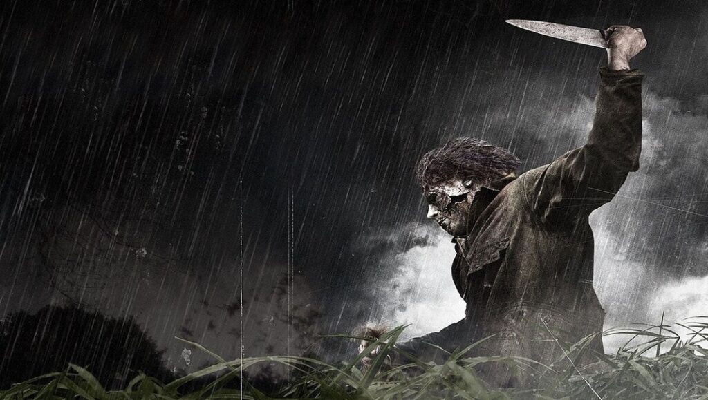 Halloween II — Rob Zombie Halloween II movie poster. Michael Myers in the rain, holding a knife. Rob Zombie film.