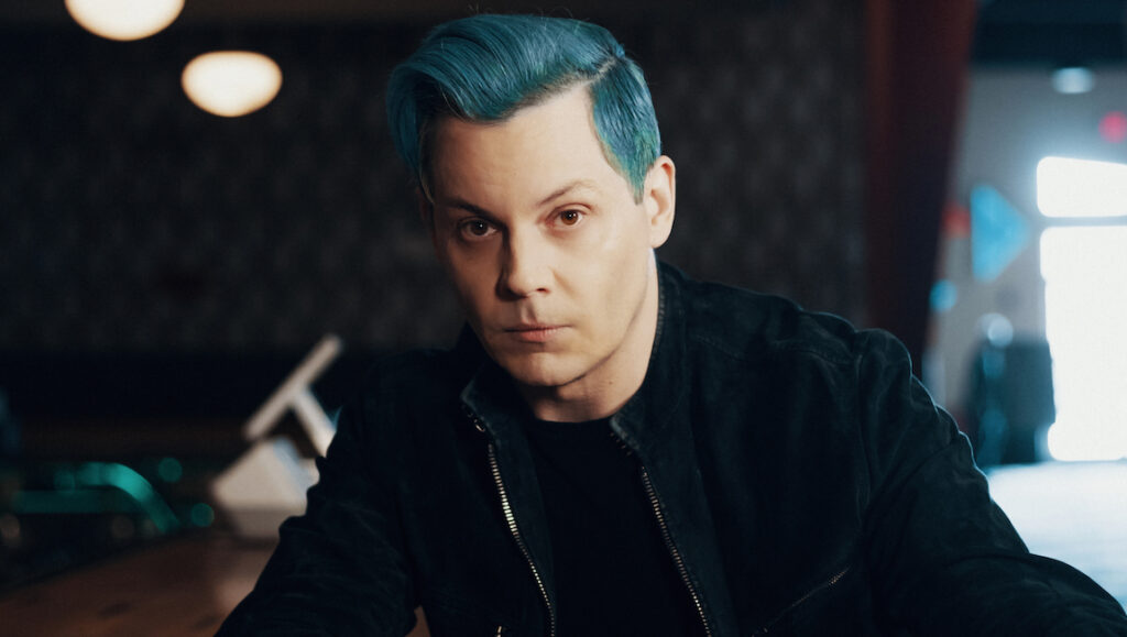 Jack White — Fear of the Dawn Jack White, April 2022 album roundup. Musician with blue hair wearing a black jacket.
