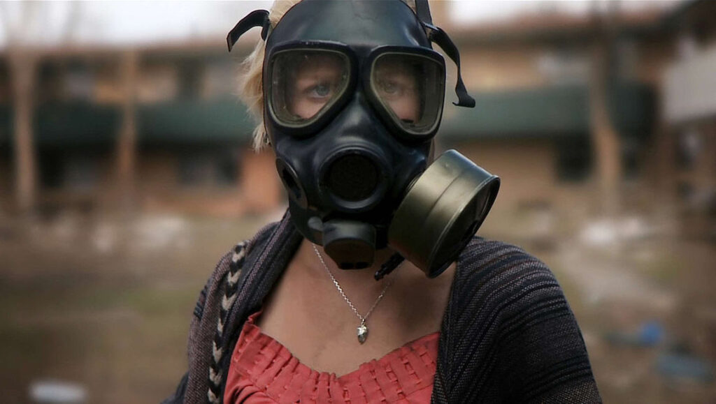 Monsters — Gareth Edwards Woman wearing a black gas mask. Protection from monsters or hazardous air.