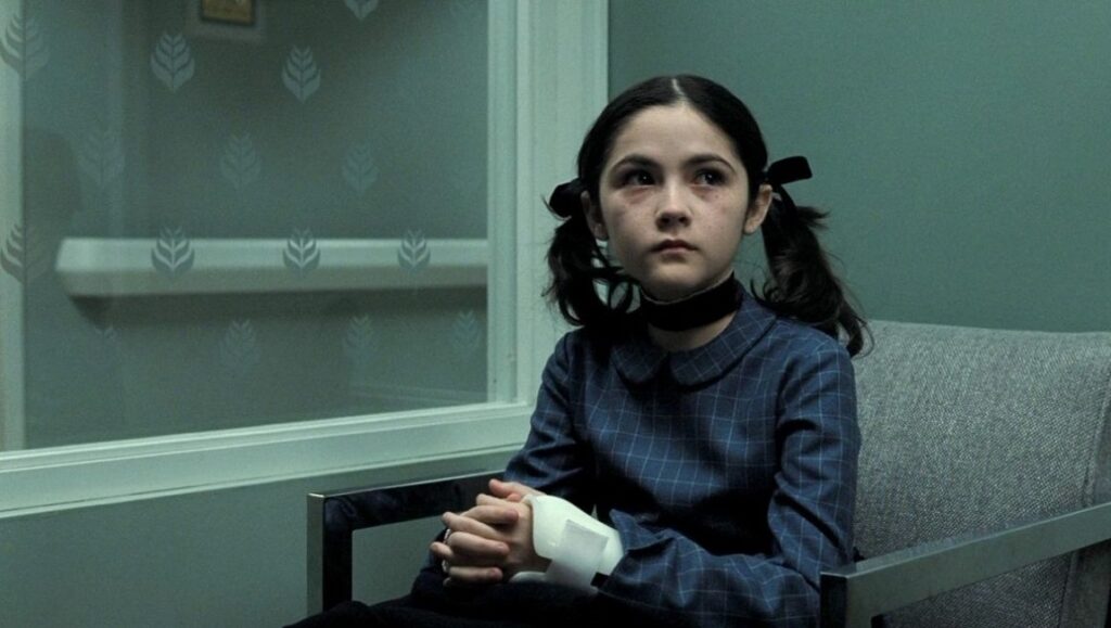 Esther, the Orphan movie character. Girl with pigtails, ribbon, and a bandage on her hand.