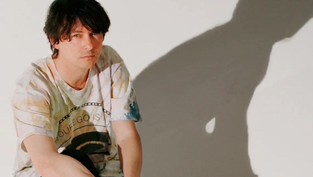 Panda Bear, aka Noah Lennox, of Animal Collective, portrait with shadow. Person Pitch era.