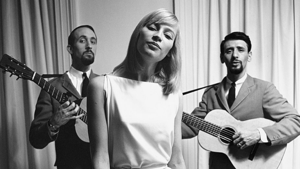 Peter, Paul and Mary, folk music group. Black and white portrait with guitars.