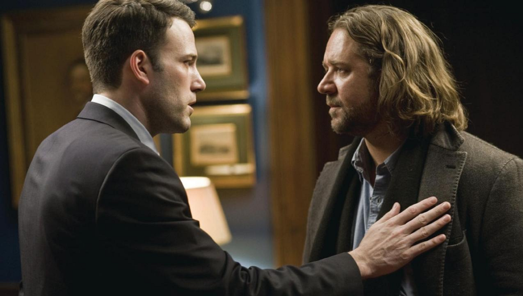 State of Play movie scene: Ben Affleck and Russell Crowe face each other in a tense moment.