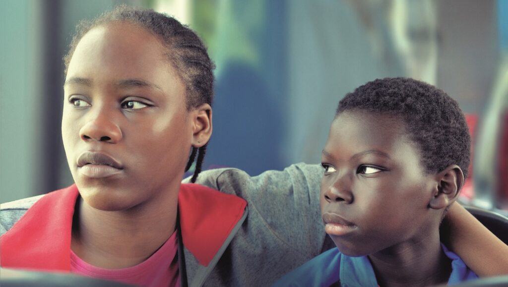 Tori and Lokita — Jean-Pierre & Luc Dardenne Tori and Lokita at Cannes Film Festival. Two young actors looking off-screen.