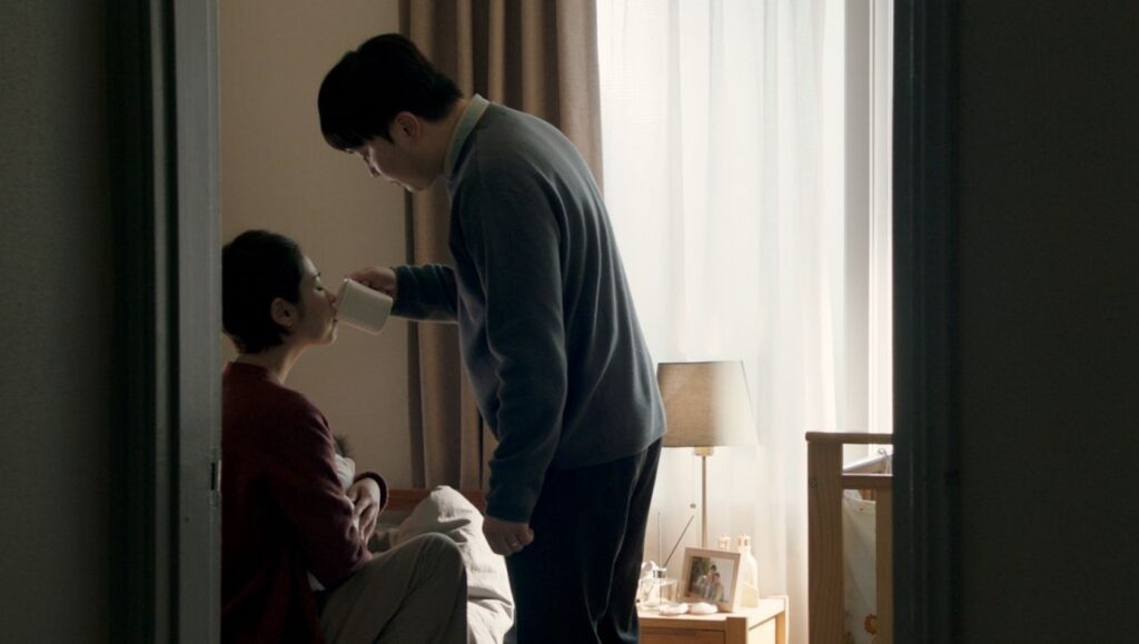 Seire — Kang Park Seire film still. A man offers a woman a drink in a bedroom. Fantasia Film Festival 2022.