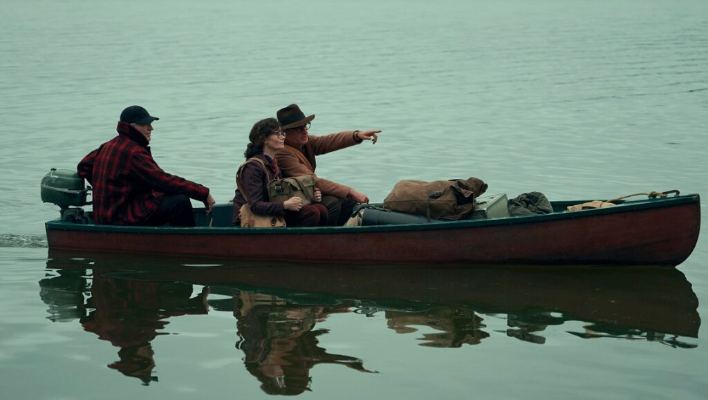 Cabinet of Curiosities Episode 8: “The Murmuring” — Jennifer Kent Cabinet of Curiosities: The Murmuring scene. A couple rides in a boat on the water with a guide.