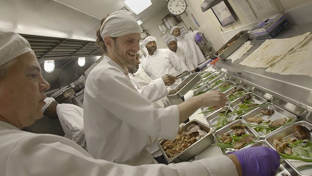 Coldwater Kitchen film still. Chefs preparing meals in a kitchen. DOC NYC 2022 documentary film.