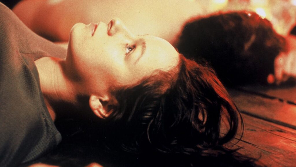 Chilling scene from Morvern Callar, directed by Lynne Ramsay. A woman reclines, face turned upwards, in a moment of quiet intensity.