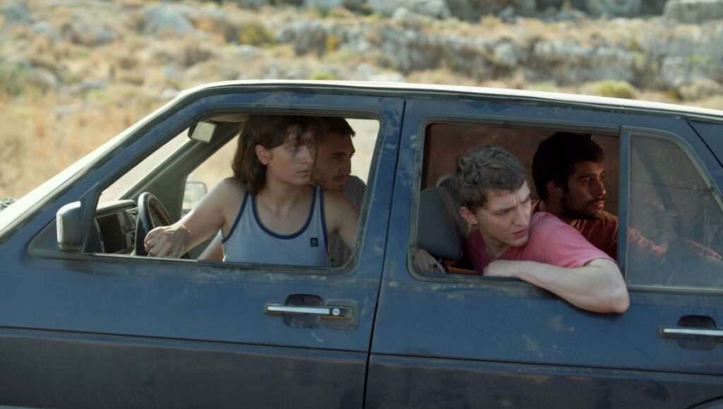 Last Summer film still from TIFF 2023. Four young people in a car. Drama, coming-of-age themes.