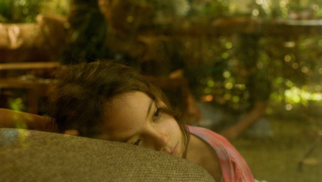 Pensive woman resting head. Limerence, love, and emotional wellness concept. Portrait, close-up.