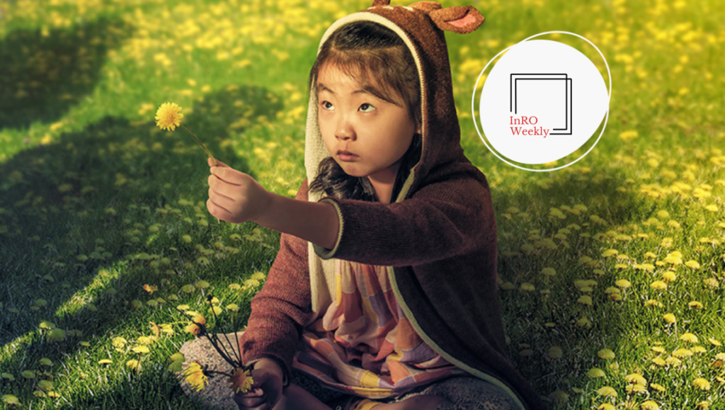 InRO Weekly — Volume 1, Issue 5 InRO Weekly magazine cover: Girl in deer hoodie with dandelion in a field.