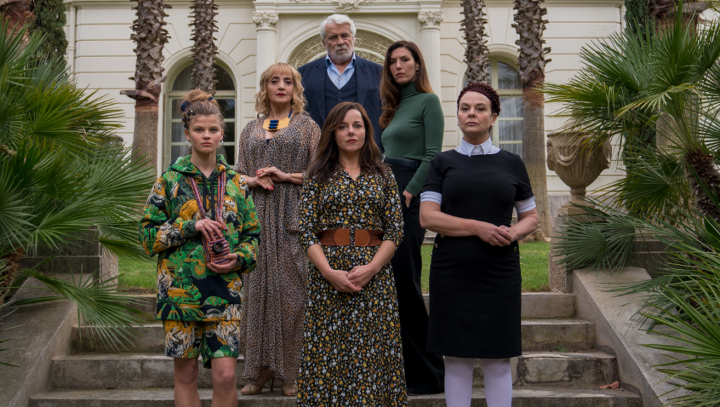 The Origin of Evil film cast stands on stairs. Family drama, mystery, and suspense. Florent Gouëlou film.