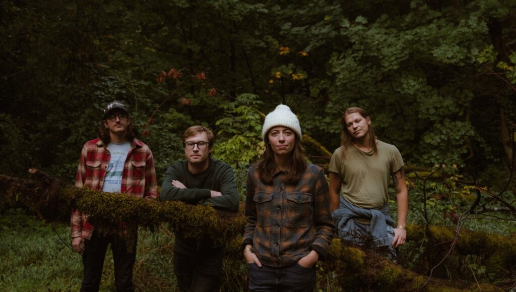 good. honest. fun. — An Interview with Ratboys’ Julia Steiner Ratboys band portrait. Julia Steiner of Ratboys with bandmates in a forest setting. Indie rock band.