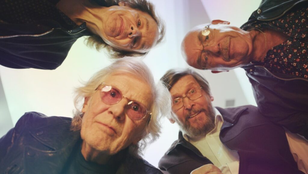 The Zombies documentary, Hung Up on a Dream at SXSW '23. Band members looking down at the camera.