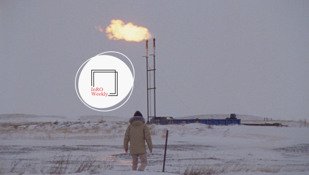 InRO Weekly magazine cover: Gas flare in snowy field. Oil and gas industry. Man walking toward flare.