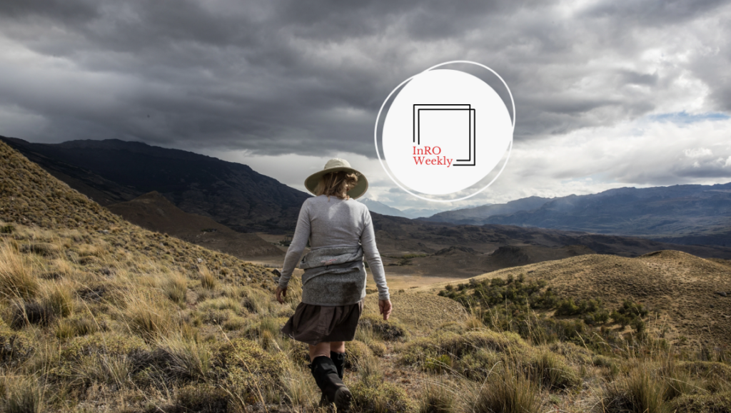 Woman hiking in mountains. Adventure travel magazine cover design. Outdoor landscape with stormy sky.