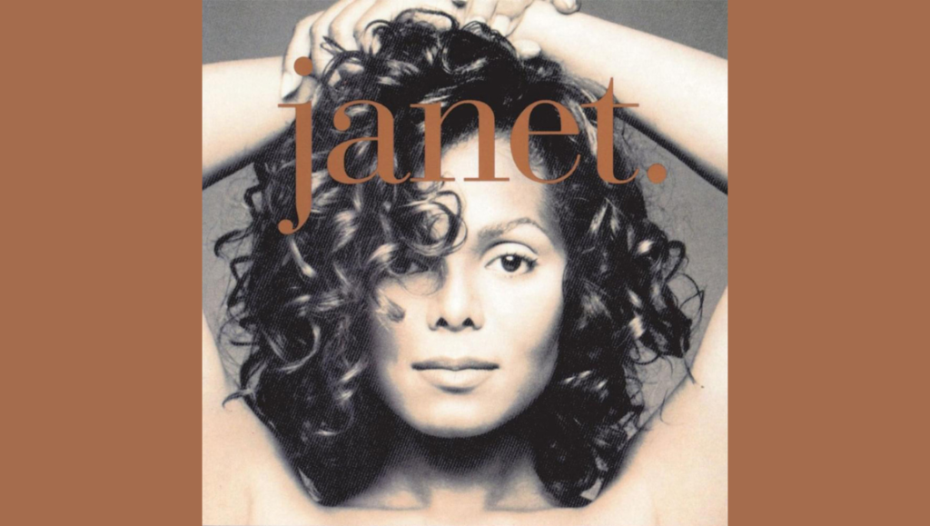 Janet Jackson's janet. album cover. Features Janet with curly hair and arms raised.