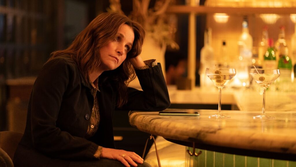 You Hurt My Feelings — Nicole Holofcener You Hurt My Feelings movie still. Julia Louis-Dreyfus at a bar with martinis.