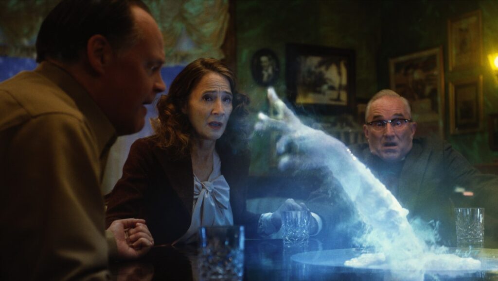 Brooklyn 45 — Ted Geoghegan Brooklyn 45 movie scene. Cast reacts to a ghostly apparition at a table. Horror film.