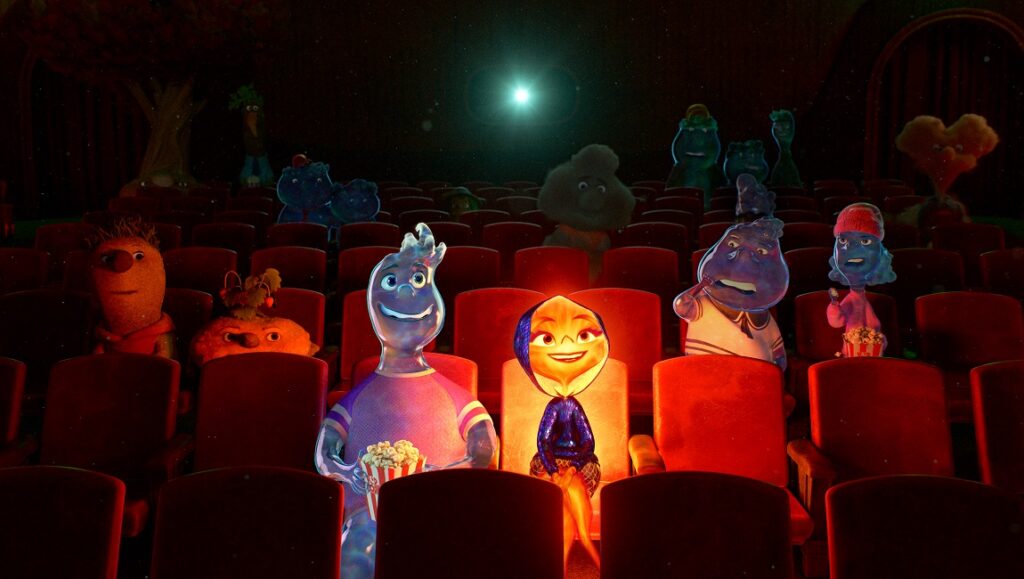 Elemental — Peter Sohn Elemental movie scene. Water and fire characters watch a film in a crowded theater.