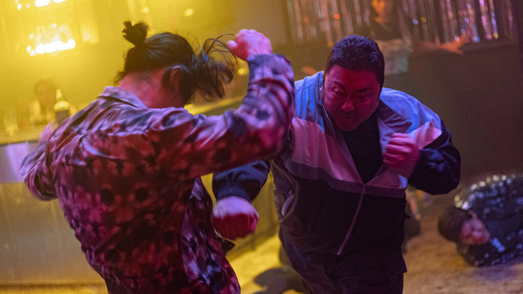 Ma Dong-seok in The Roundup: No Way Out fighting. Korean action cinema. Lee Sang-yong film. Crime thriller.