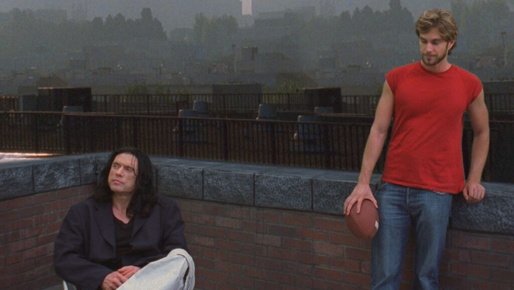 Tommy Wiseau and Mark on the roof in The Room. Cult film scene.