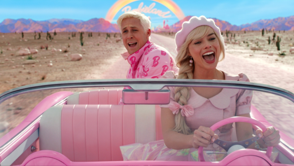 Margot Robbie as Barbie driving a pink convertible with Ryan Gosling as Ken in the Barbie movie.