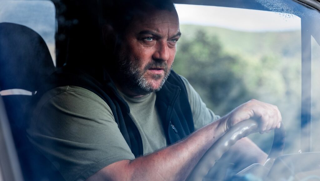 Denis Ménochet in The Beasts, a Rodrigo Sorogoyen film. Man driving.