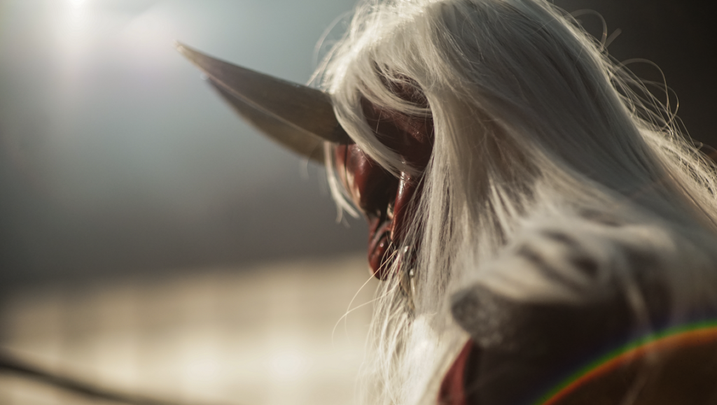 Kitty the Killer film still from New York Asian Film Festival 2023. Close-up of a horned, masked figure.