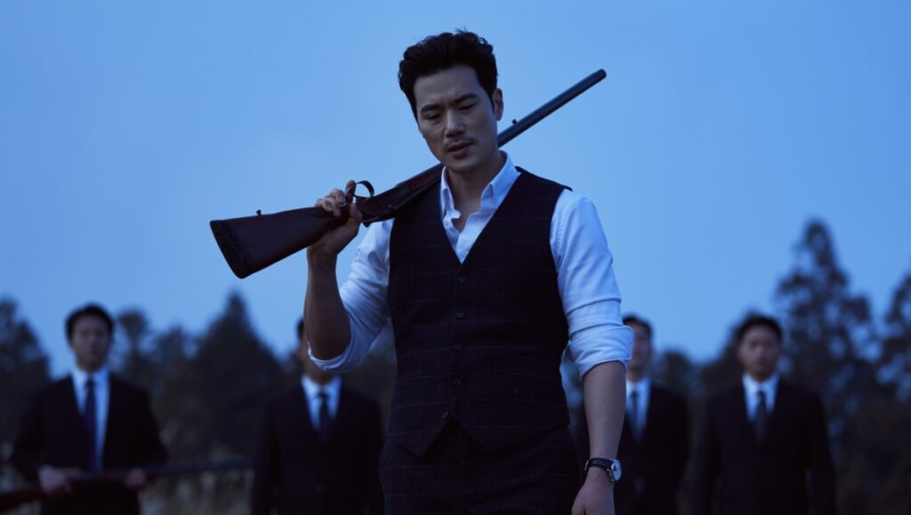 The Childe — Park Hoon-jung The Childe Korean action thriller: Man with rifle and suited bodyguards.