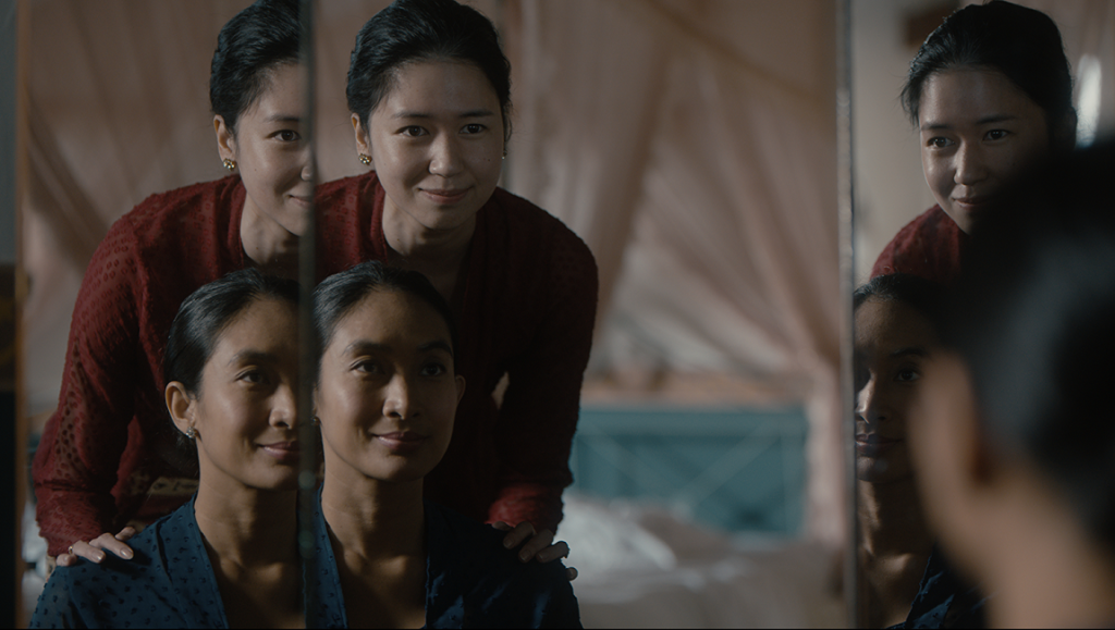 Before, Now & Then film still: Kamila Andini's character reflected in a mirror. Indonesian cinema.