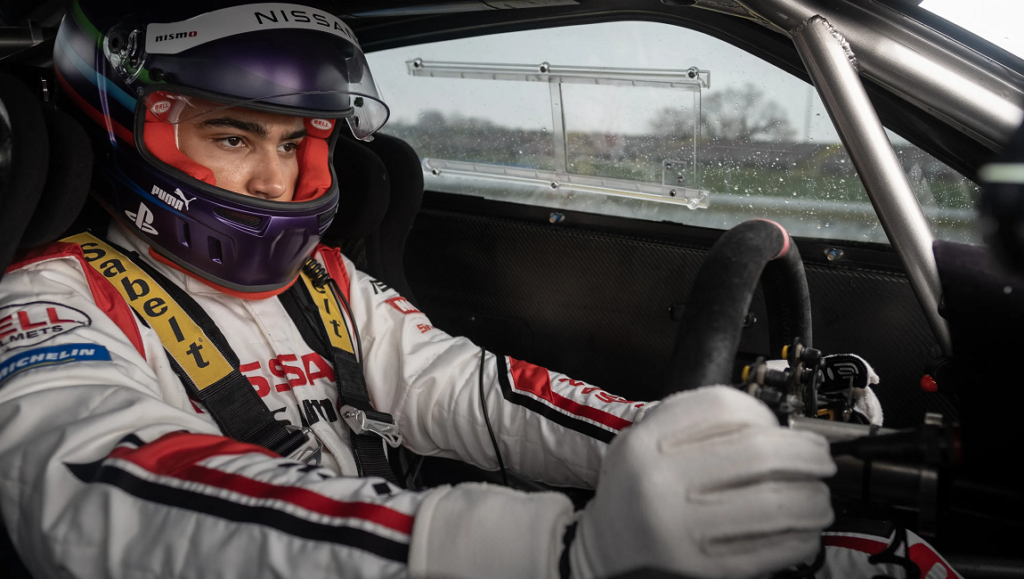 Neill Blomkamp's *Gran Turismo*: Driver in racing suit and helmet inside a Nissan race car.