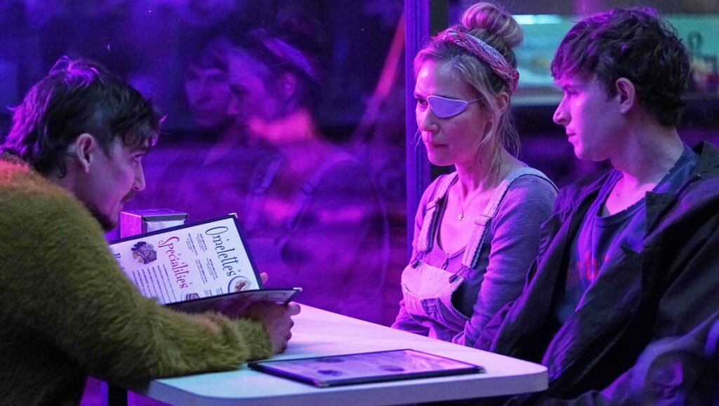 The Passenger — Carter Smith The Passenger movie scene. Woman with eye patch, man with menu, young man. Blumhouse Television production.