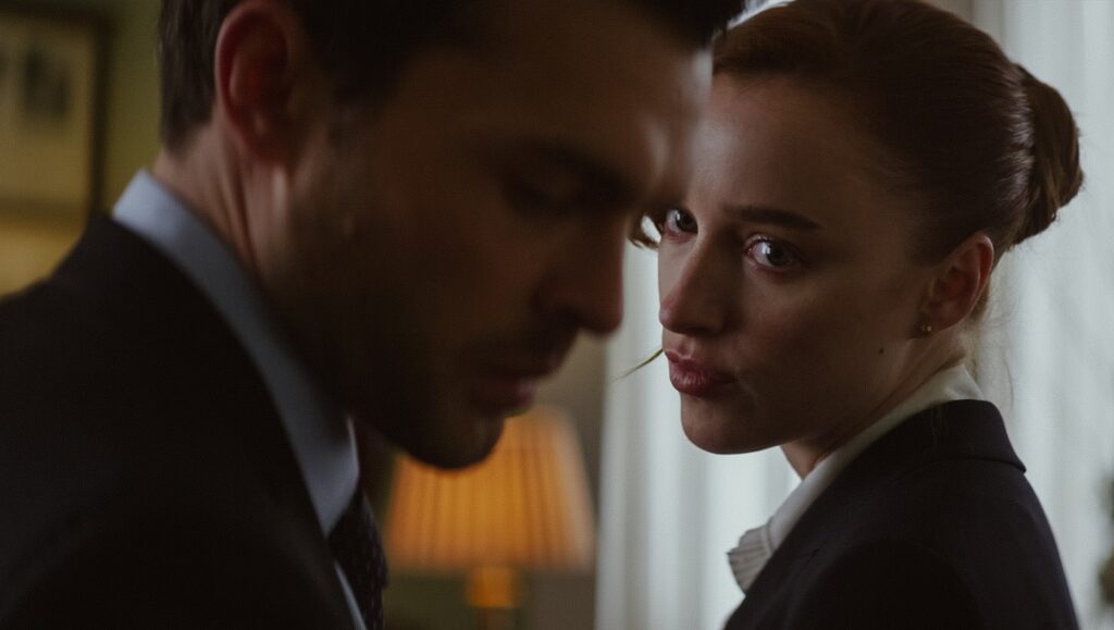 Fair Play movie still: Alden Ehrenreich and Phoebe Dynevor in a tense moment. Chloe Domont film.