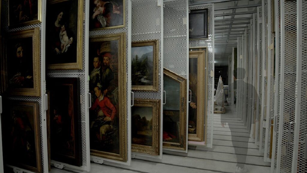 TIFF 2023 — Dispatch 4: He Thought He Died, Pain Hustlers, Snow Leopard Art storage racks with framed paintings. TIFF 2023: He Thought He Died.