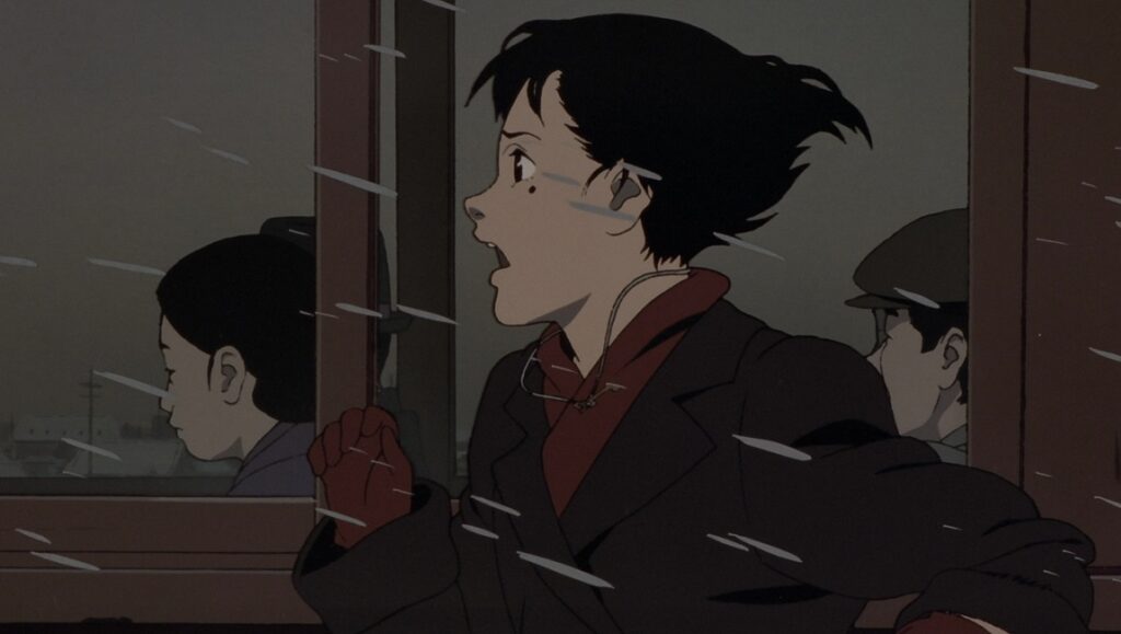 A scene from Satoshi Kon's *Millennium Actress* anime film. A young woman looks out a train window.