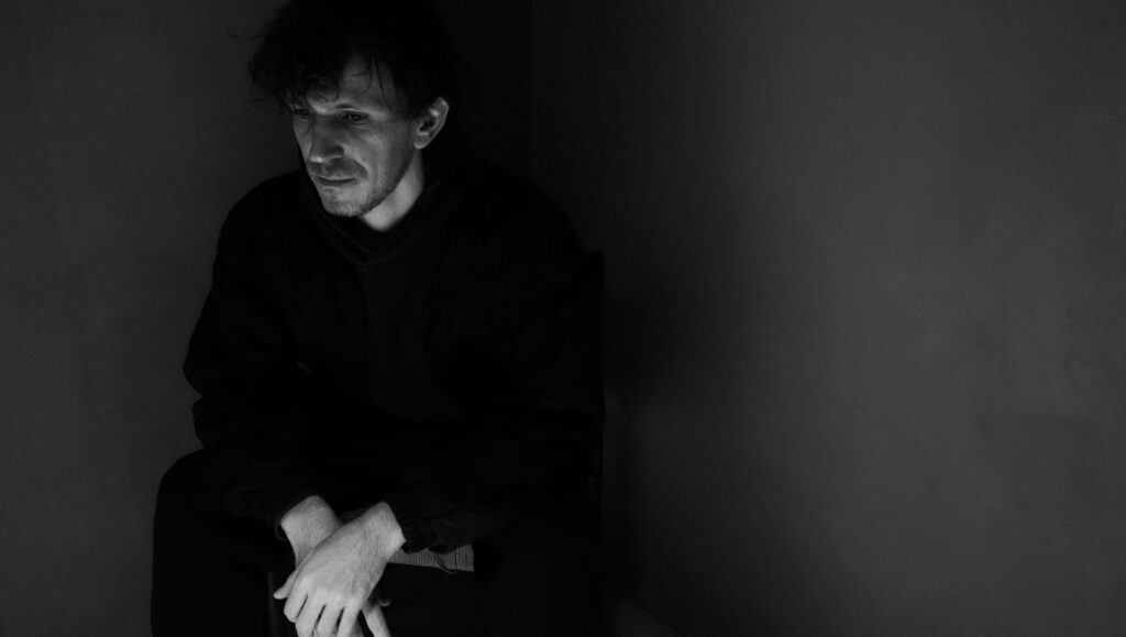 Black and white portrait of Eduardo Williams, director of The Human Surge 3. Moody, thoughtful.