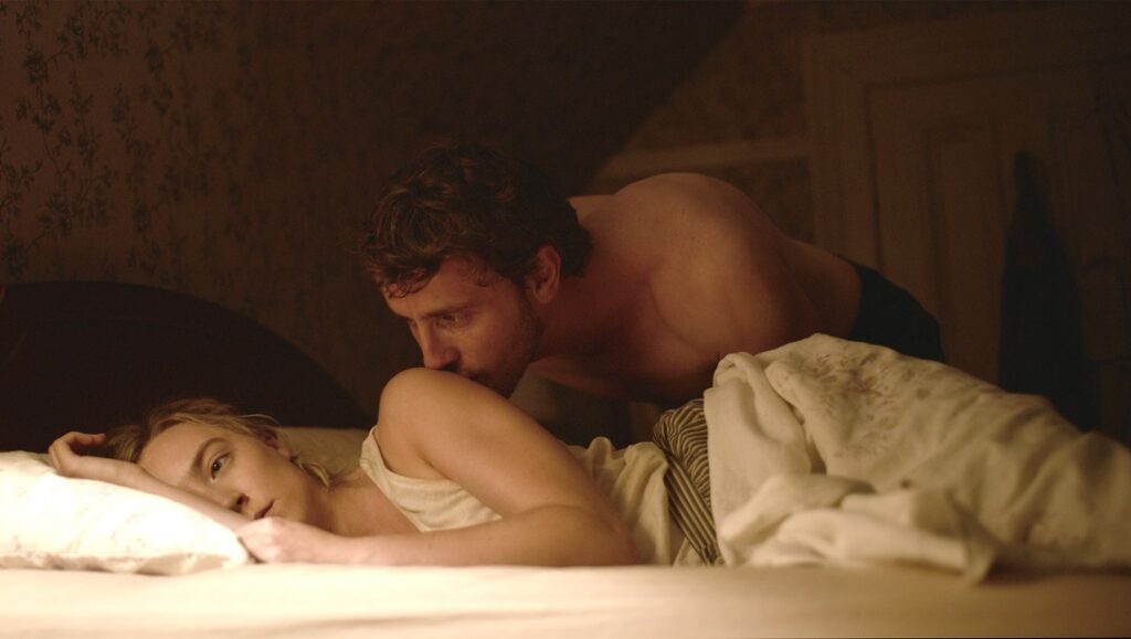 Foe movie still: Saoirse Ronan and Paul Mescal in bed. Garth Davis film.