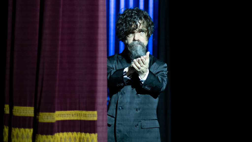 She Came to Me — Rebecca Miller Peter Dinklage in She Came to Me. Actor clapping, wearing a suit on stage. Rebecca Miller film.