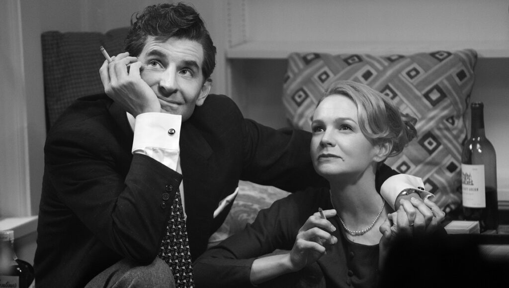 Maestro film still: Bradley Cooper and Carey Mulligan in black and white. NYFF 2023.