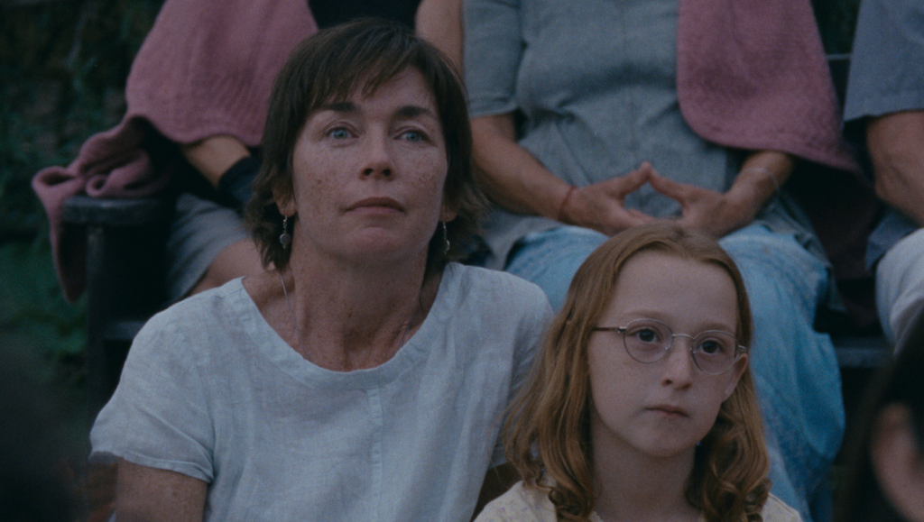 Still from Janet Planet at NYFF 2023. Actress Julianne Nicholson with a young actress, looking thoughtful. Indie film.