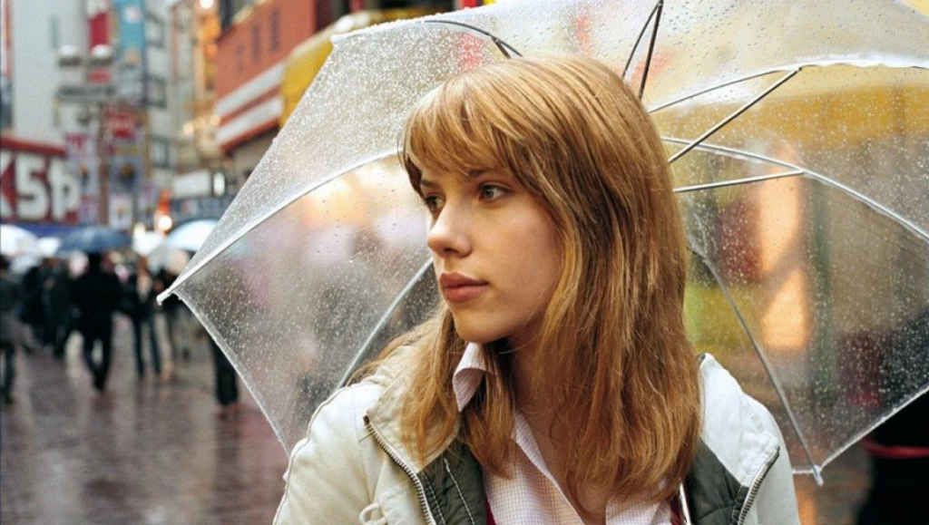 Scarlett Johansson in Lost in Translation under umbrella in Tokyo, Japan. Sofia Coppola film.