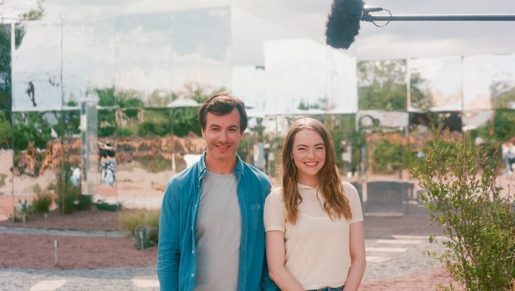 Nathan Fielder and Emma Stone in The Curse. The show features a mirrored art installation.