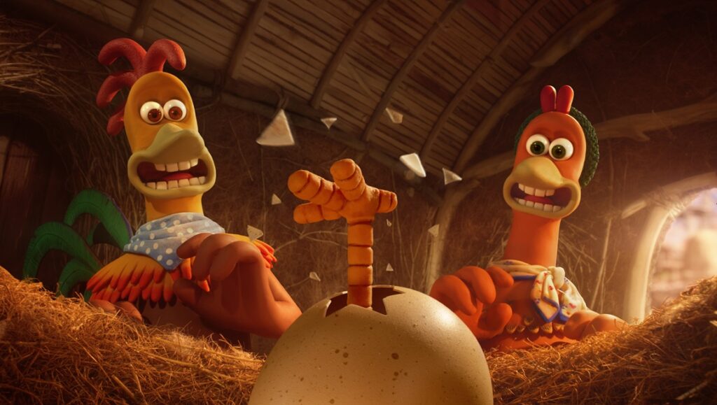 Chicken Run: Dawn of the Nugget still. Ginger and Rocky watch as their chick hatches from an egg.